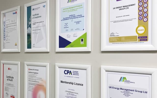 UKEM compliance certificates wall including CHAS and CPA frames