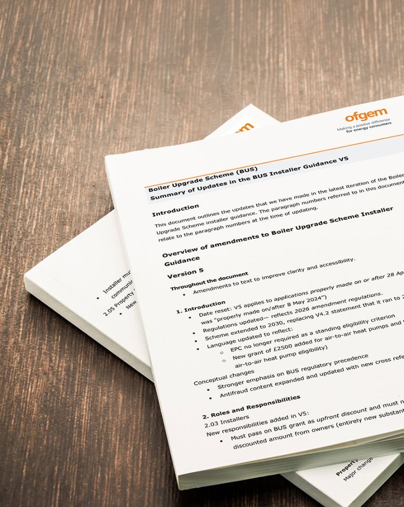 Ofgem Boiler Upgrade Scheme installer guidance V5 document on a desk