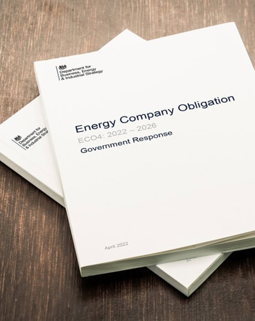 UK government Energy Company Obligation ECO4 2022 to 2026 government response documents on a desk