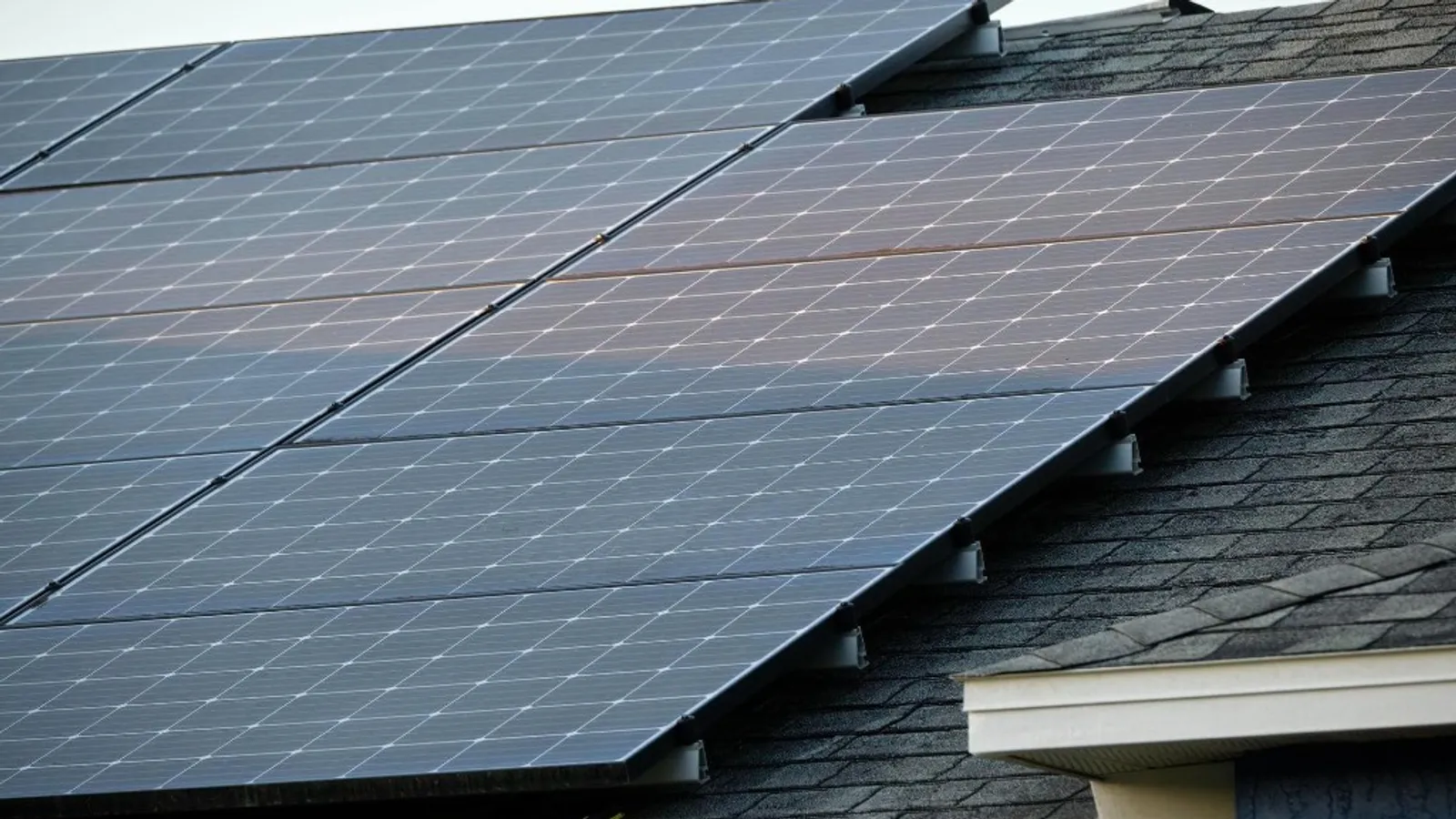 Close-up of a domestic solar panel array installed on a UK home roof