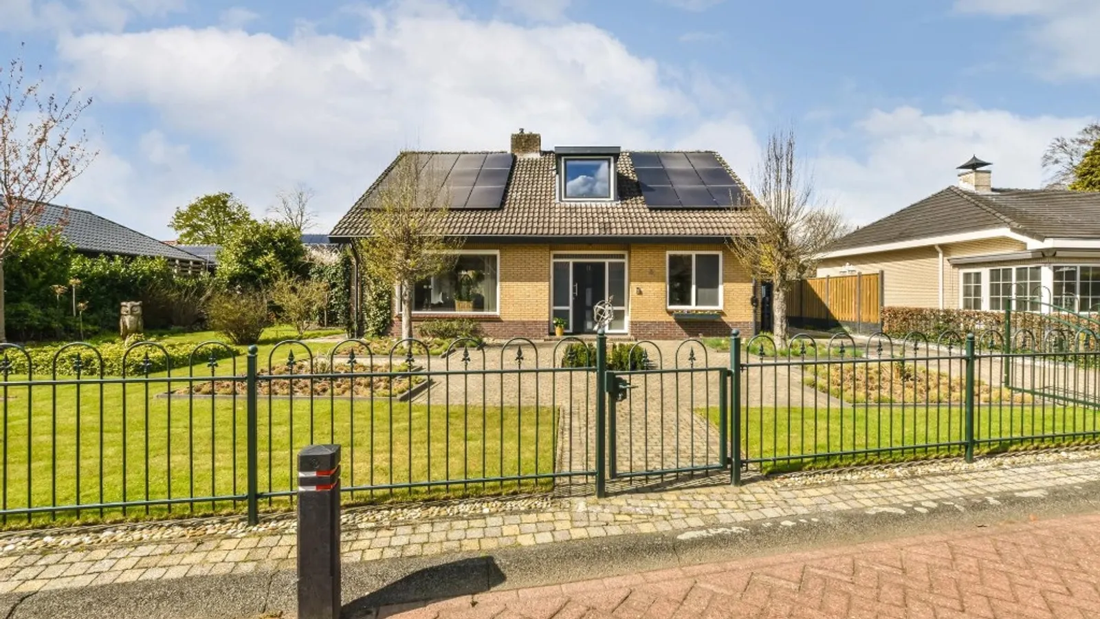Solar panels fitted to a UK semi-detached home with garden frontage