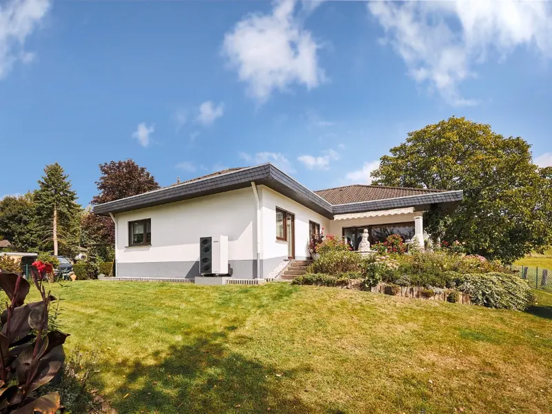 Vaillant aroTHERM plus air source heat pump outdoor unit on a studio background