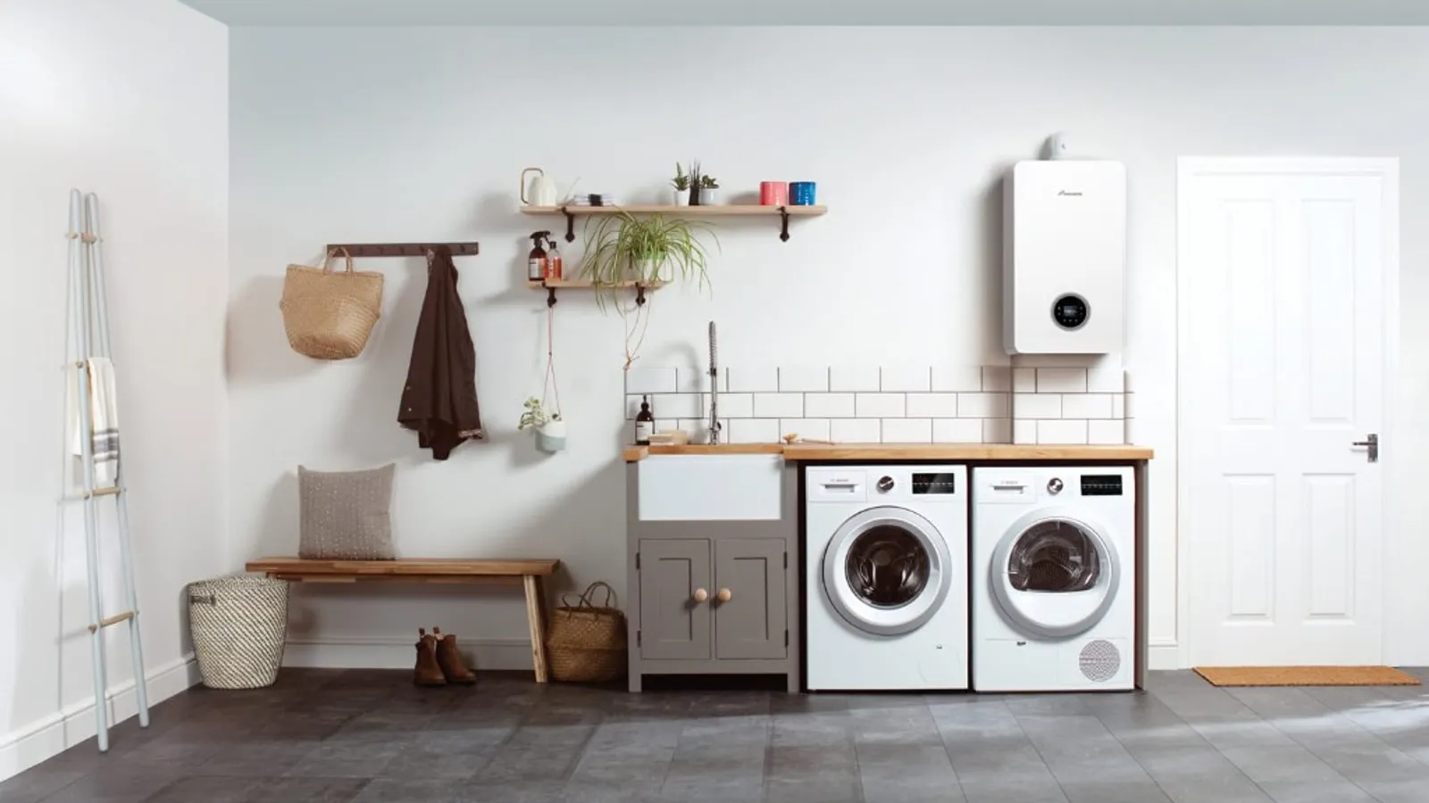Worcester Bosch Greenstar boiler installed in a UK home utility room alongside washing machines