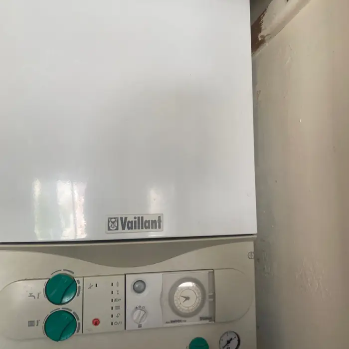 Older Vaillant boiler with a mechanical timer dial and green control knobs