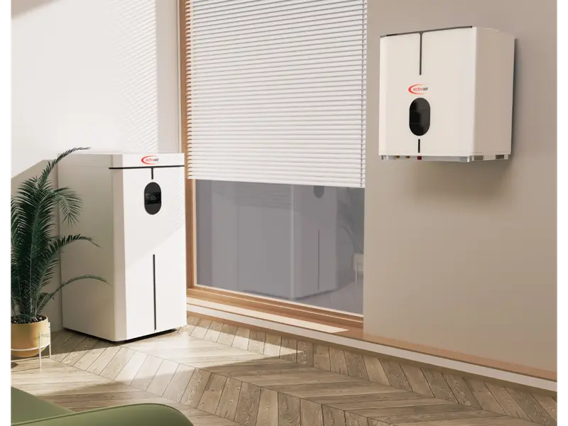 Trianco Activair indoor air source heat pumps in a living room, floor-standing and wall-hung