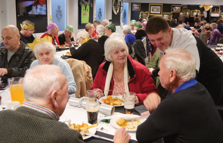 Senior residents and community members at a UKEM supported social event
